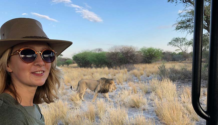 Solo traveller on a safari spotting lions whilst in south africa