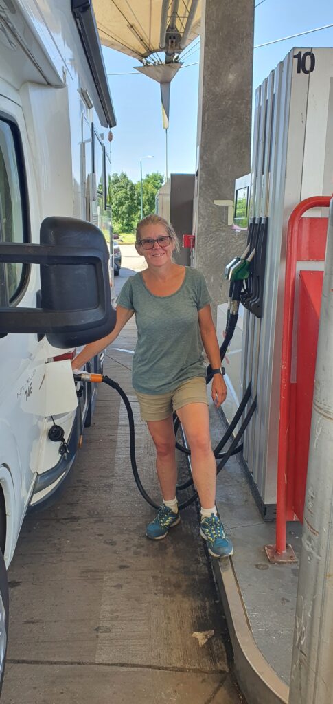 Tanya filling up the motorhome in Belgium